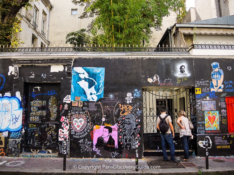 Graffiti across the front of Serge Gainsbourg's home in the 6th arrondissement