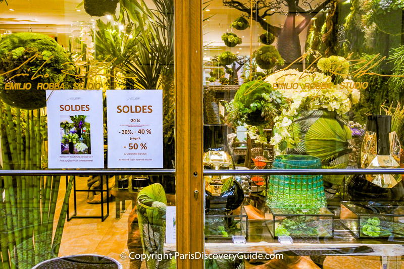 Soldes signs at Emilio Robba, designer of exquisite silk flowers in Galerie Vivienne in the 2nd arrondissement in Paris Soldes signs at Emilio Robba, designer of exquisite silk flowers in Galerie Vivienne in the 2nd arrondissement in Paris