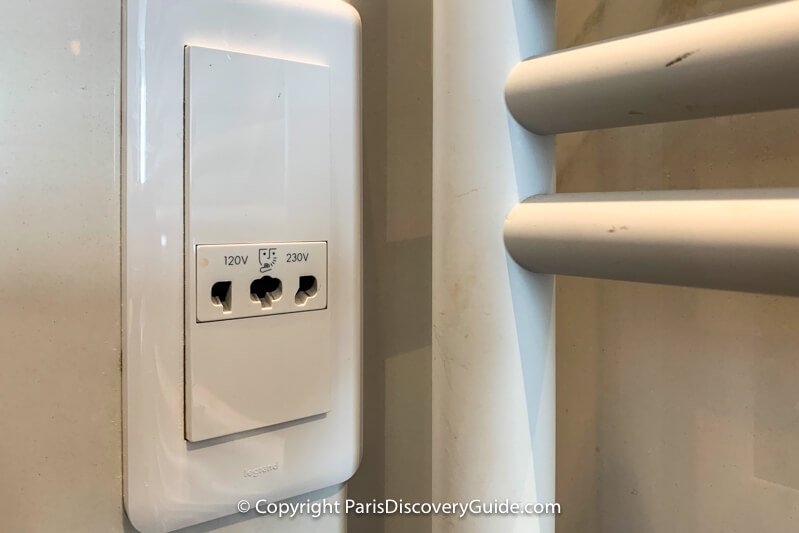 Universal socket in a bathroom at a 4-star hotel in Paris (that's a towel warmer on the right)