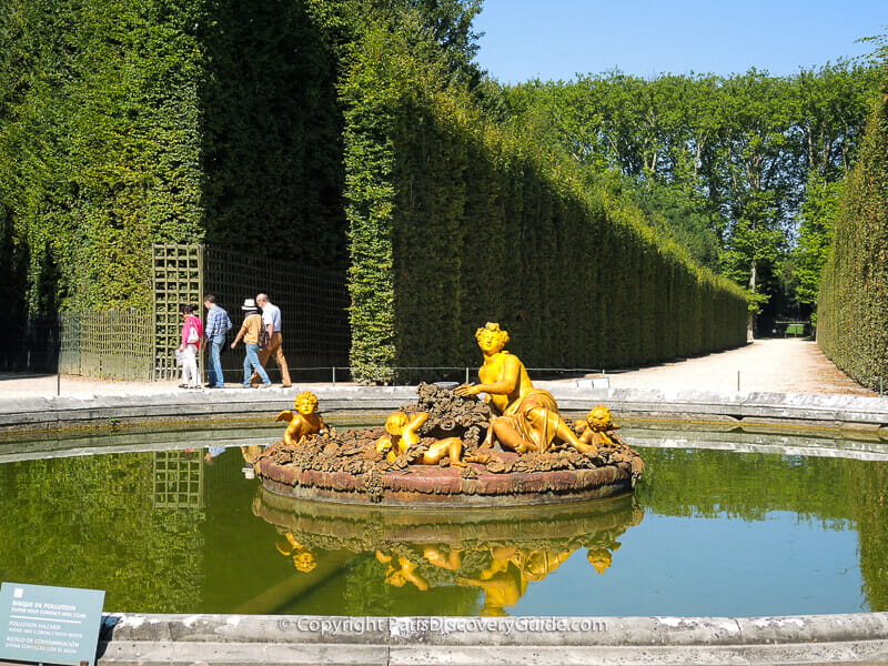 The Flora Fountain, at the crossroads of several Groves, wears a floral crown and is surrounded by flowers as Flora is the Roman goddess of flowers The Flora Fountain, at the crossroads of several Groves, wears a floral crown and is surrounded by flowers as Flora is the Roman goddess of flowers