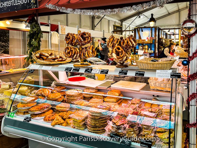 Pretzels, tortes, and patés en croute on display in the Alsatian Christmas Market