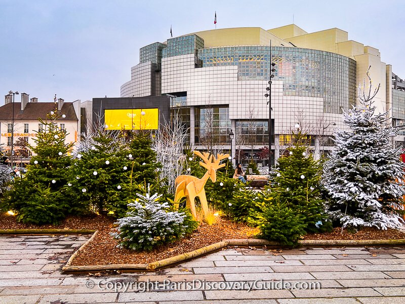 Bastille Christmas Market reindeer and trees, with Bastille Opera House in the background