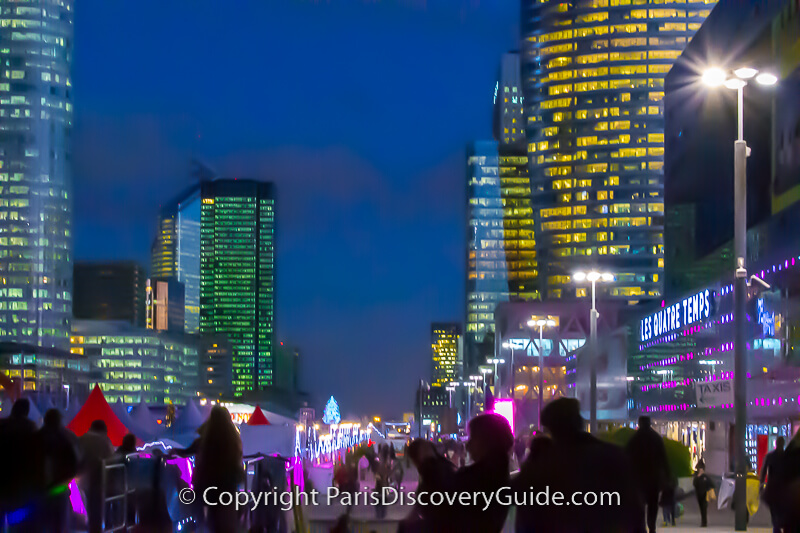 The La Defense Christmas Market and nearby skyscrapers on a slightly foggy night