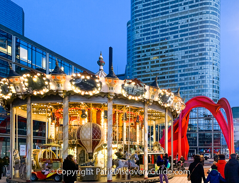 Carousel next to the Christmas Market, and Calder's Red Spider sculpture