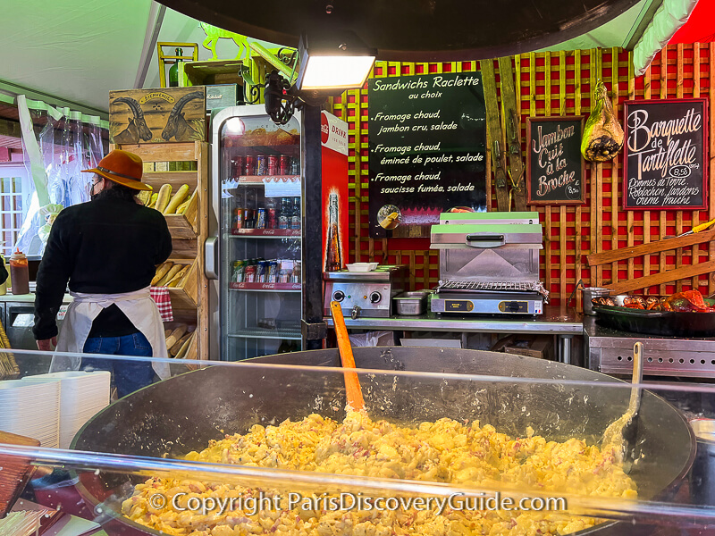 Large pan of tartiflette at one of the food court snack kiosks at La Defense's Village de Noel