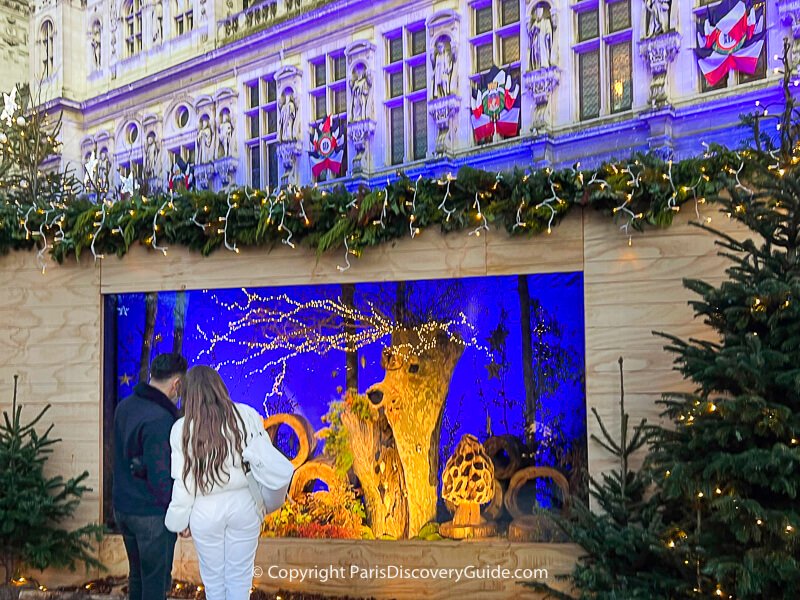 Forest scene display showing a deer with lights along its antlers