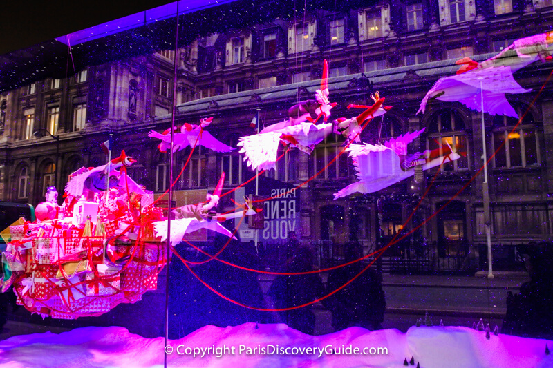 Eight beautiful white swans with elves on their backs carry a basket of gifts from Denmark as part of BHV Marais' promotion of Danish products Eight beautiful white swans with elves on their backs carry a basket of gifts from Denmark as part of BHV Marais' promotion of Danish products